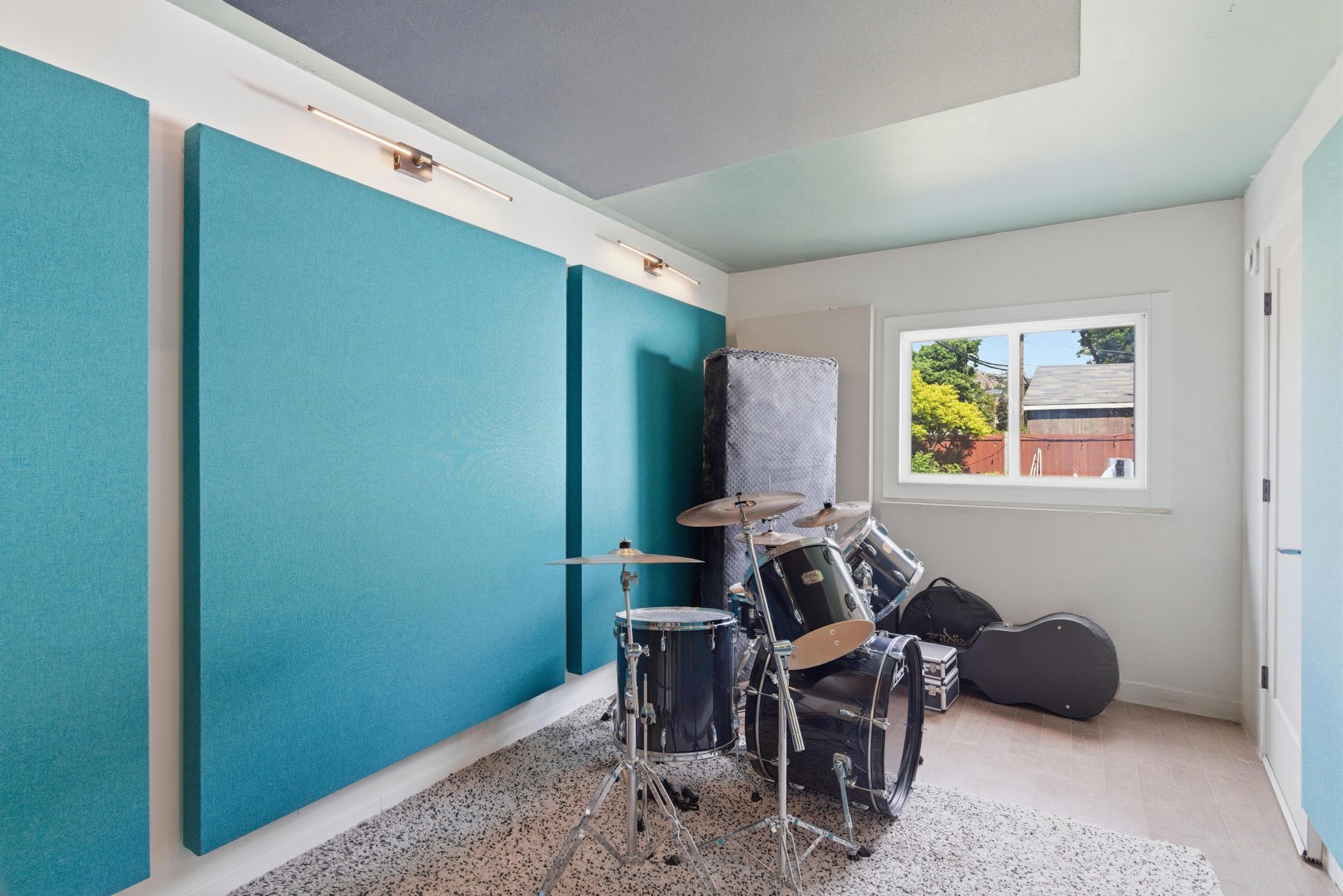 Drum kit beside acoustic panels