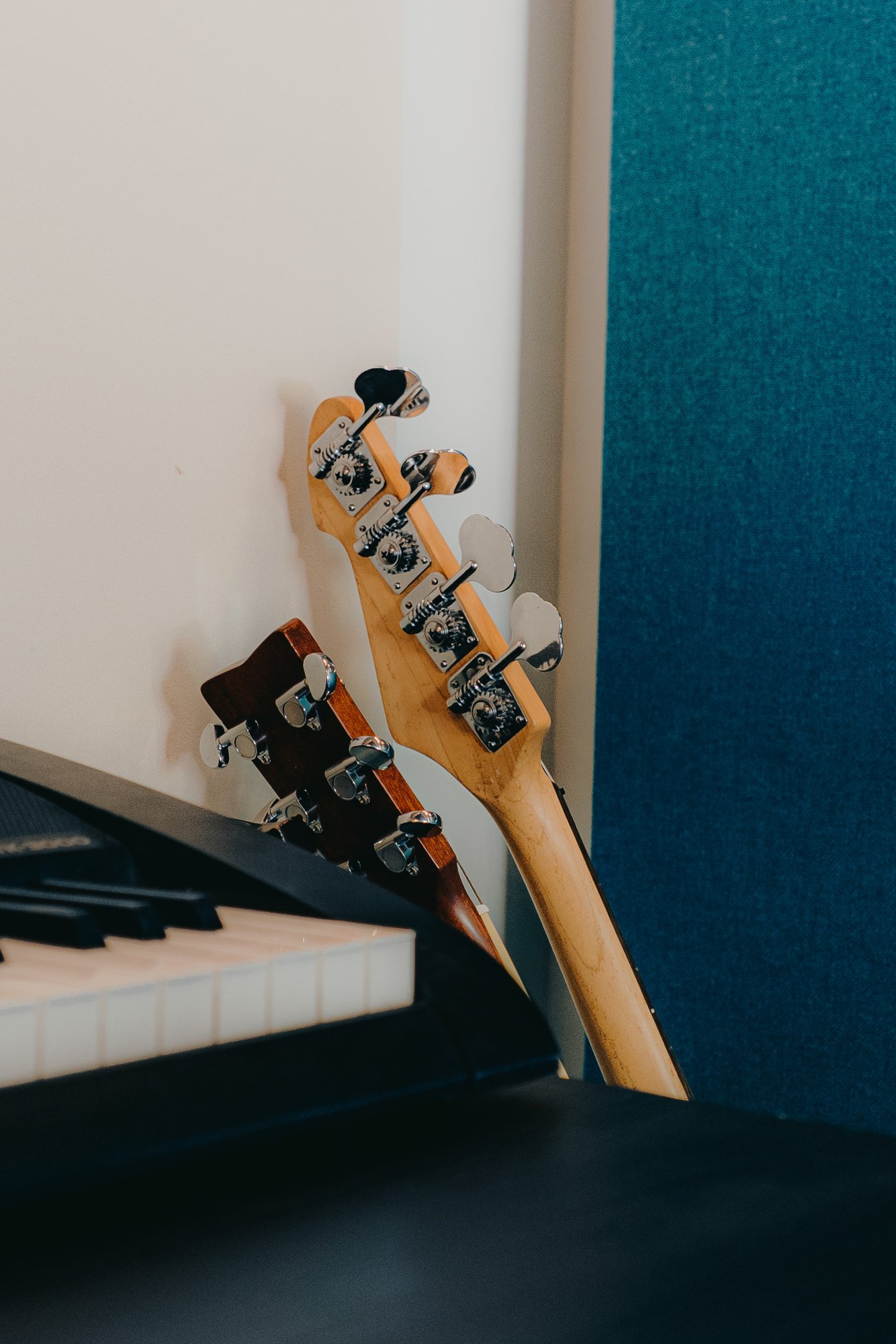 Guitars beside a keyboard